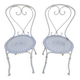 Pair of wrought iron garden chairs, antique manufacture