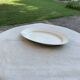 Large oval cream serving platter in ceramic - vintage model from the 1950s, wide rim.