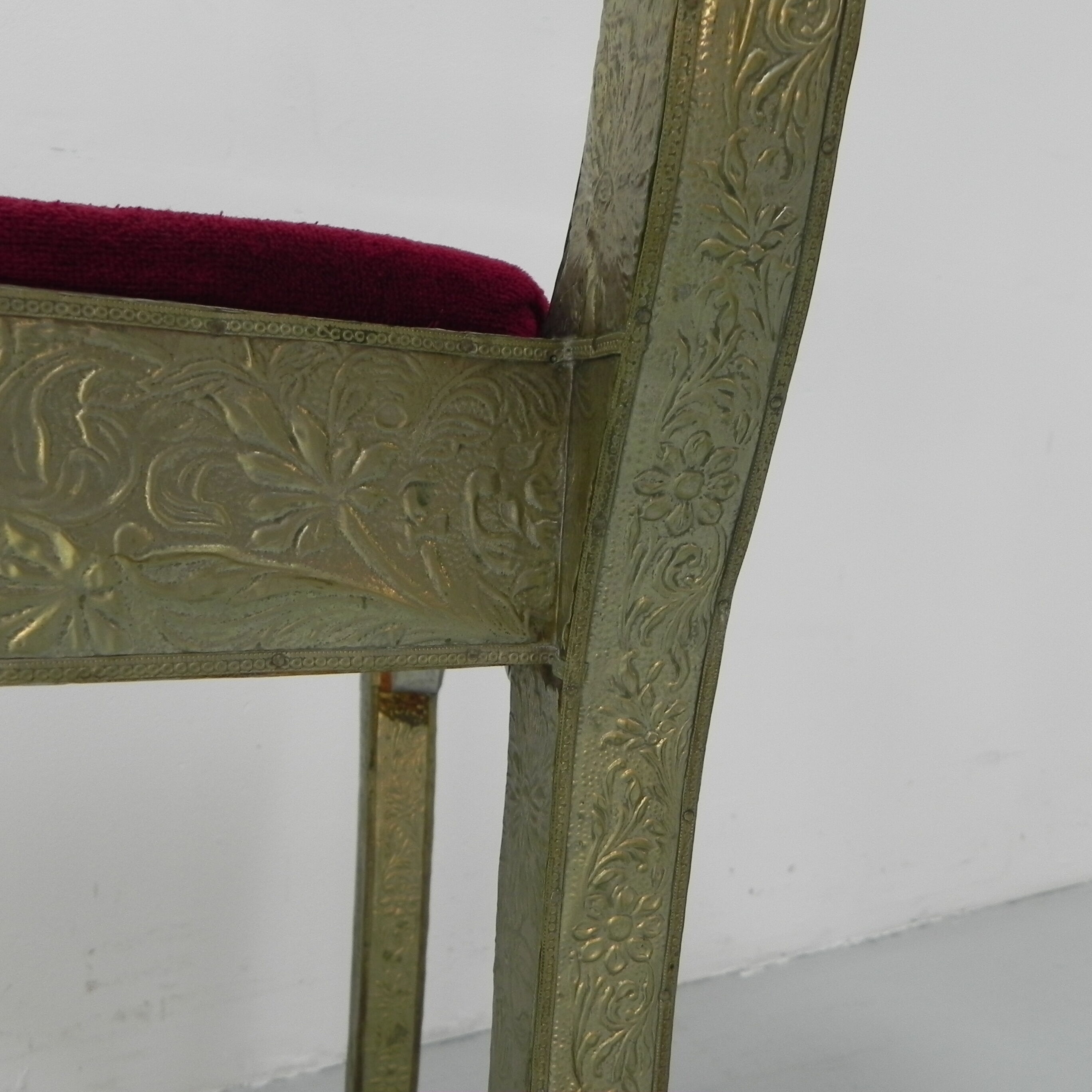 Dining chair upholstered with stamped tin