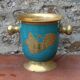 Vintage turquoise brass champagne bucket with grape decoration.