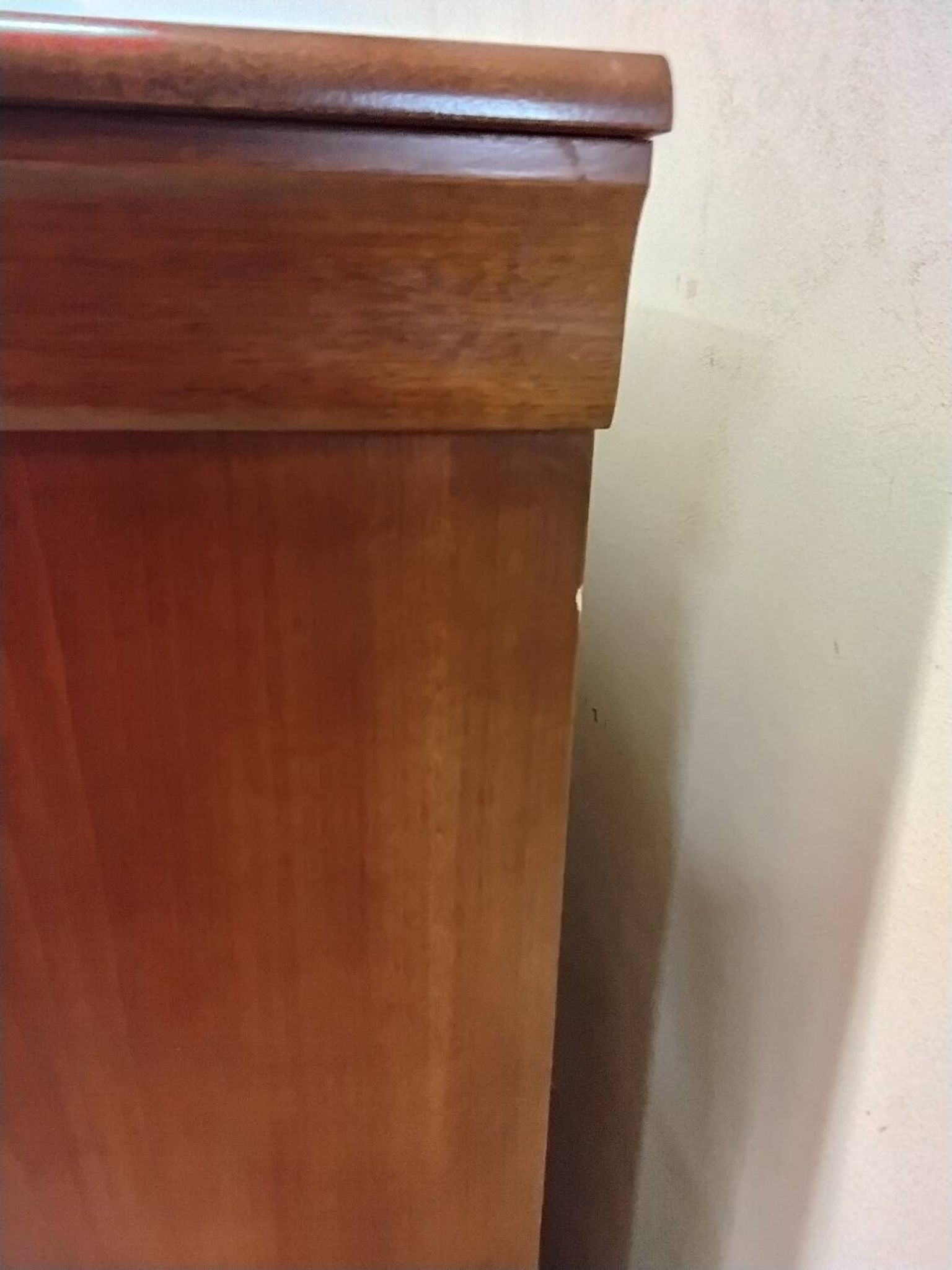 Wooden chest of drawers with a secret drawer