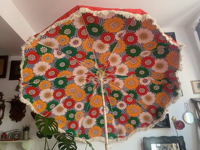 Large floral tilting beach umbrella with cotton fringes, 1960