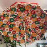 Large floral tilting beach umbrella with cotton fringes, 1960