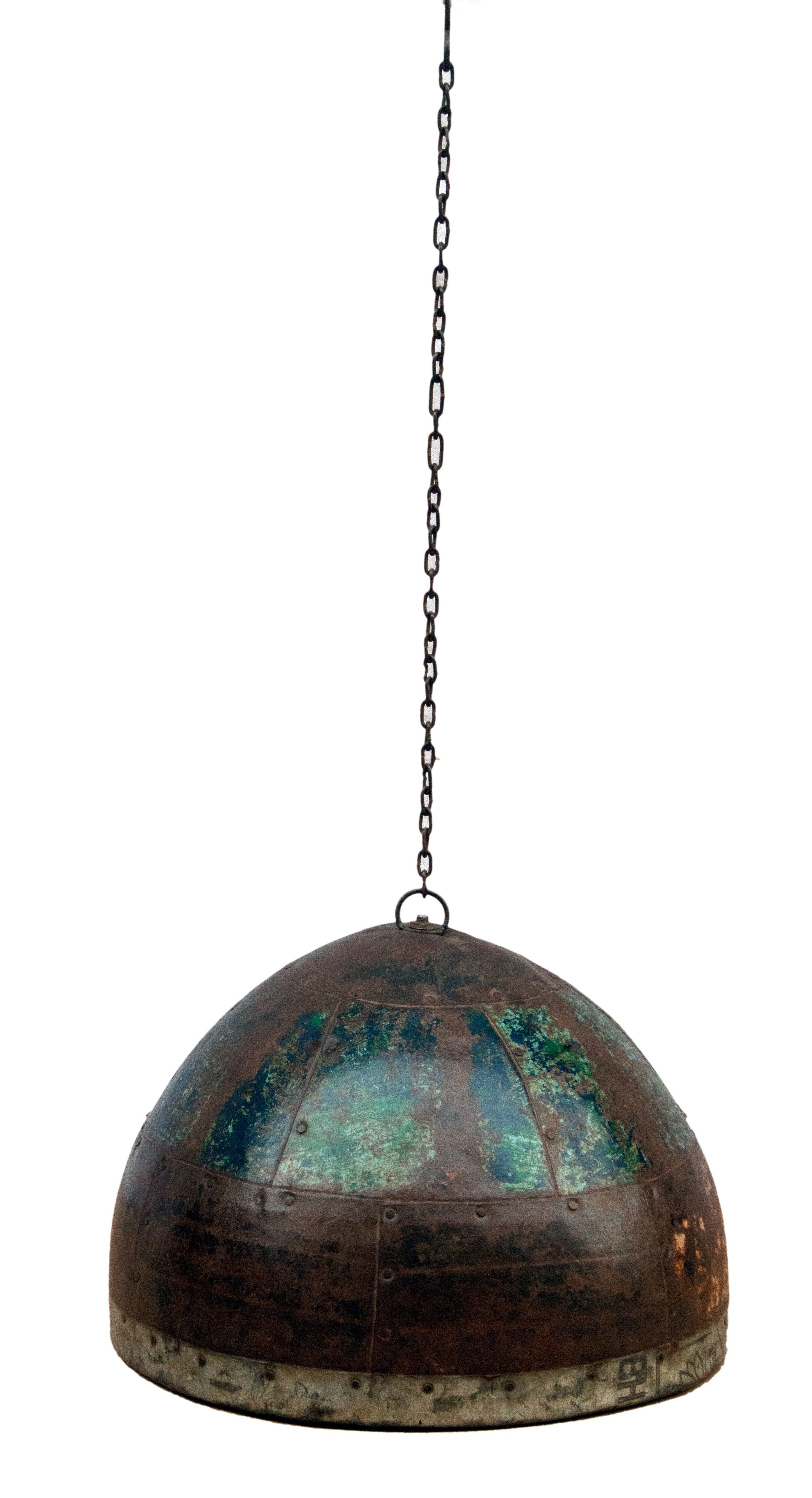 Metal hanging with its original blue-green-rust colour