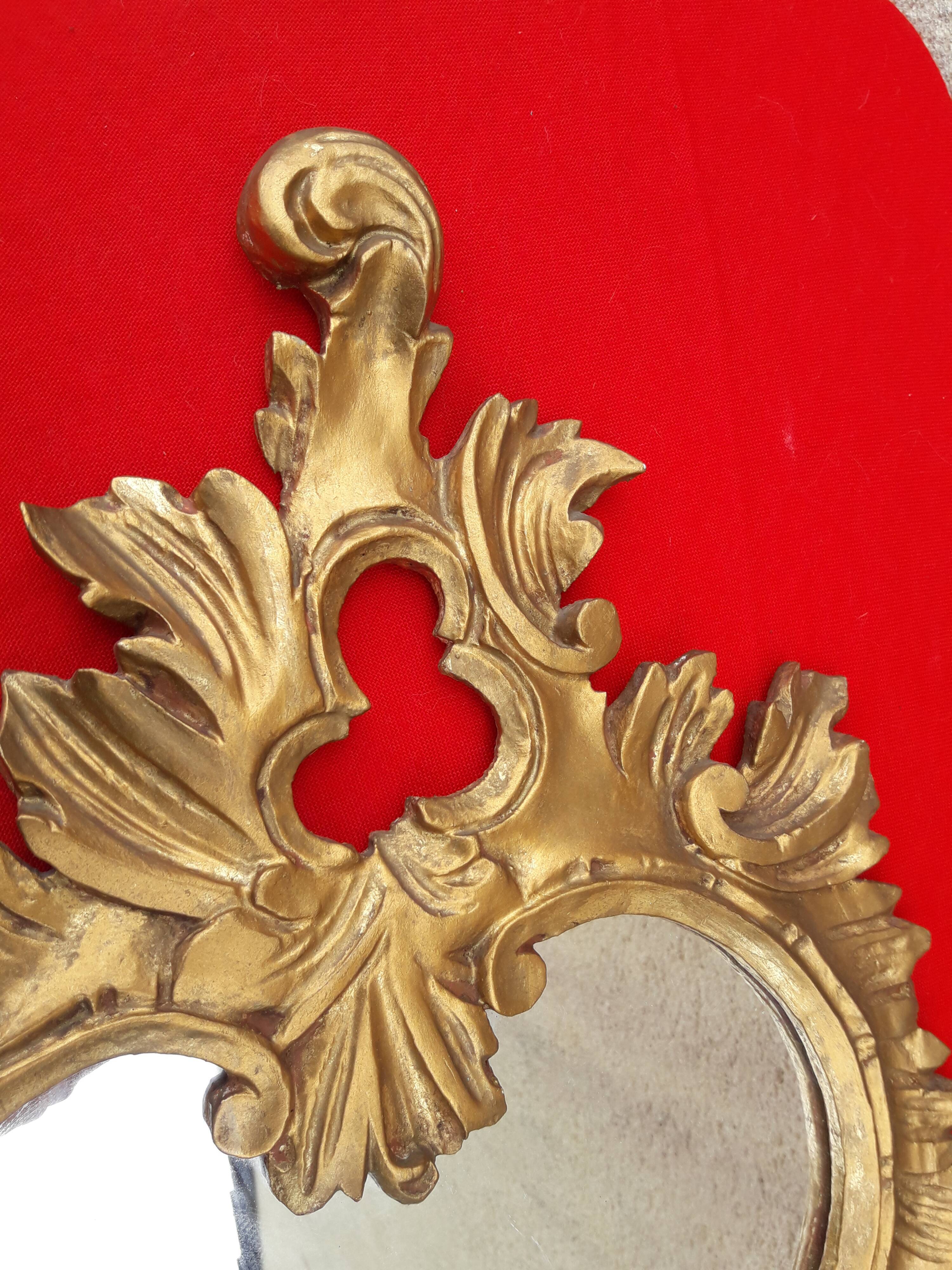 Louis XV style rocaille mirror in wood and gilded stucco