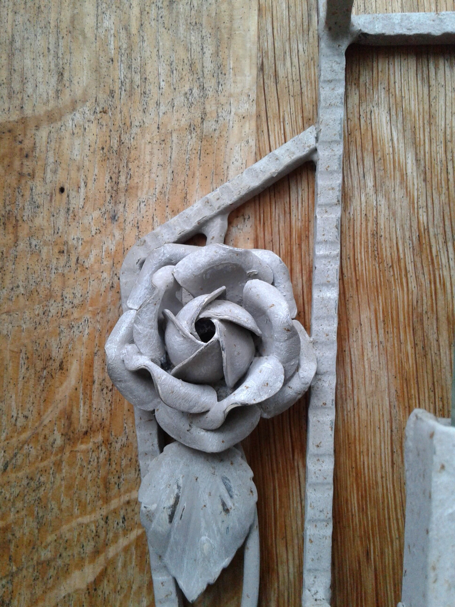 Former Wall coat hangers painted in gray iron