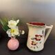 Antique pitcher in slipware with floral decoration – red and cream floral design