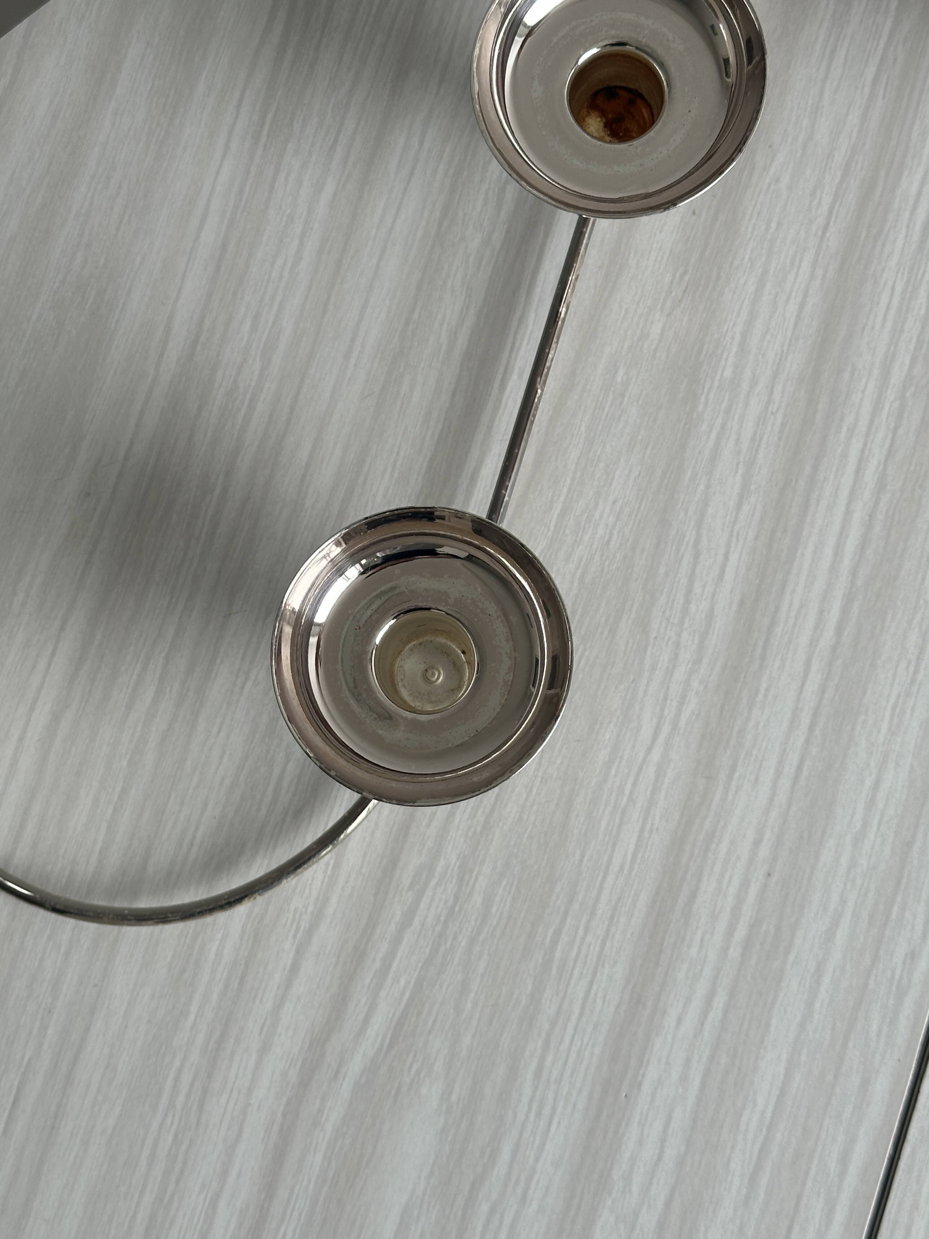 Shiny stainless steel candlestick holder