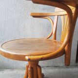 Swivel wooden armchair