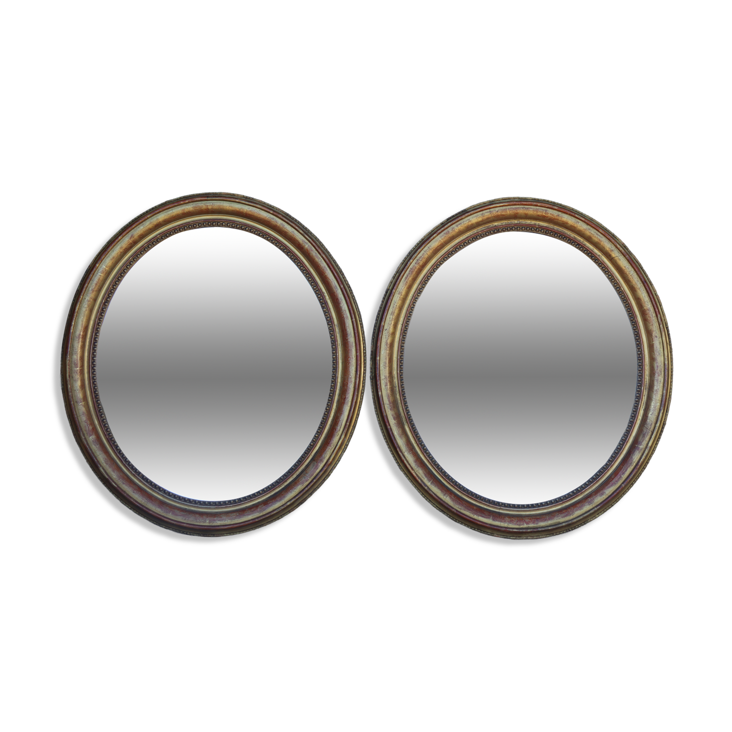 Pair of oval mirrors from the Louis Philippe period in gilded wood.