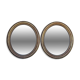 Pair of oval mirrors from the Louis Philippe period in gilded wood.