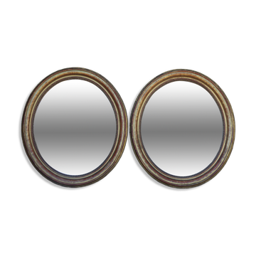 Paire de miroirs ovales en bois doré époque Louis Philippe
