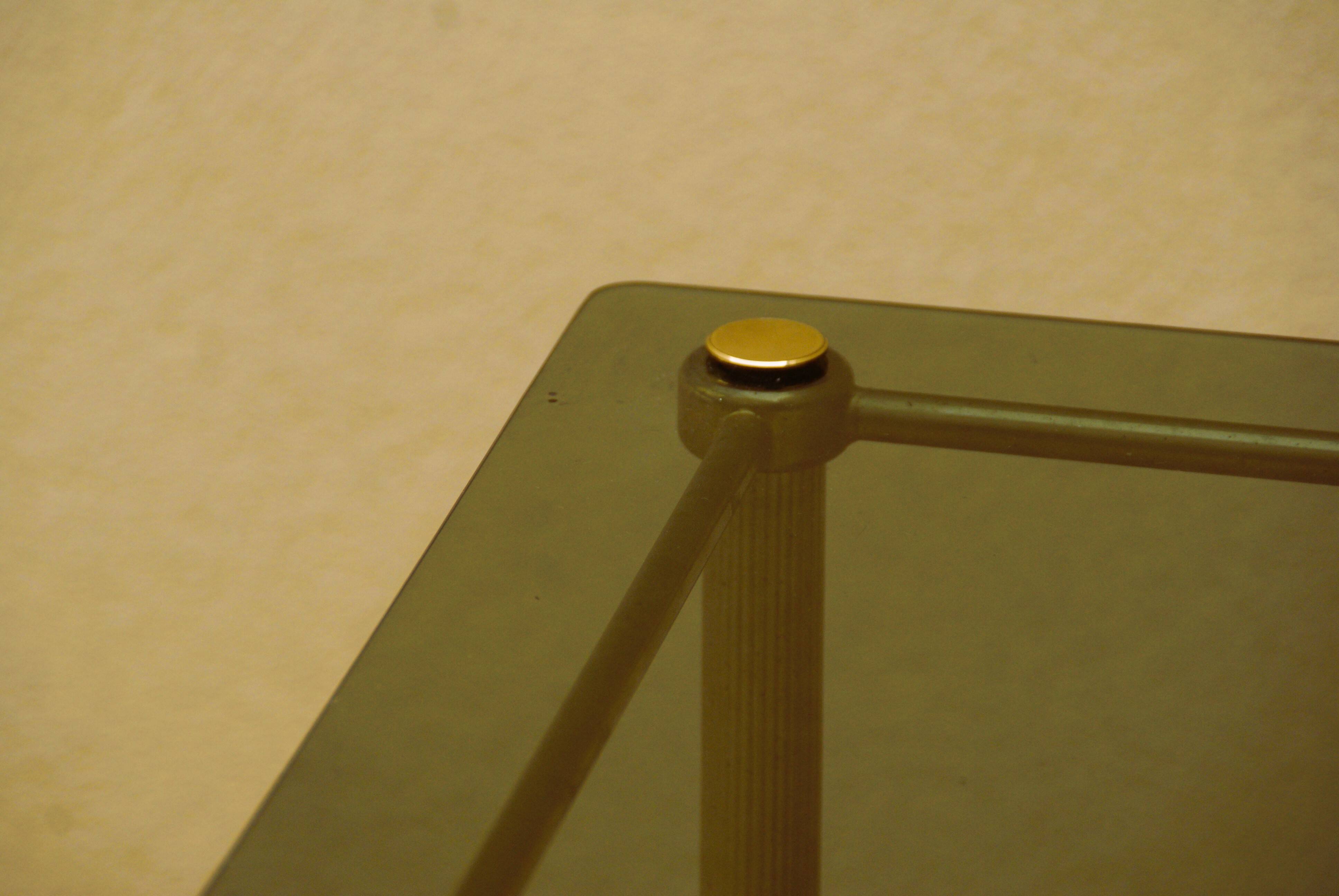 Antique brass serving trolley with smoked glass top, Louis XVI style.