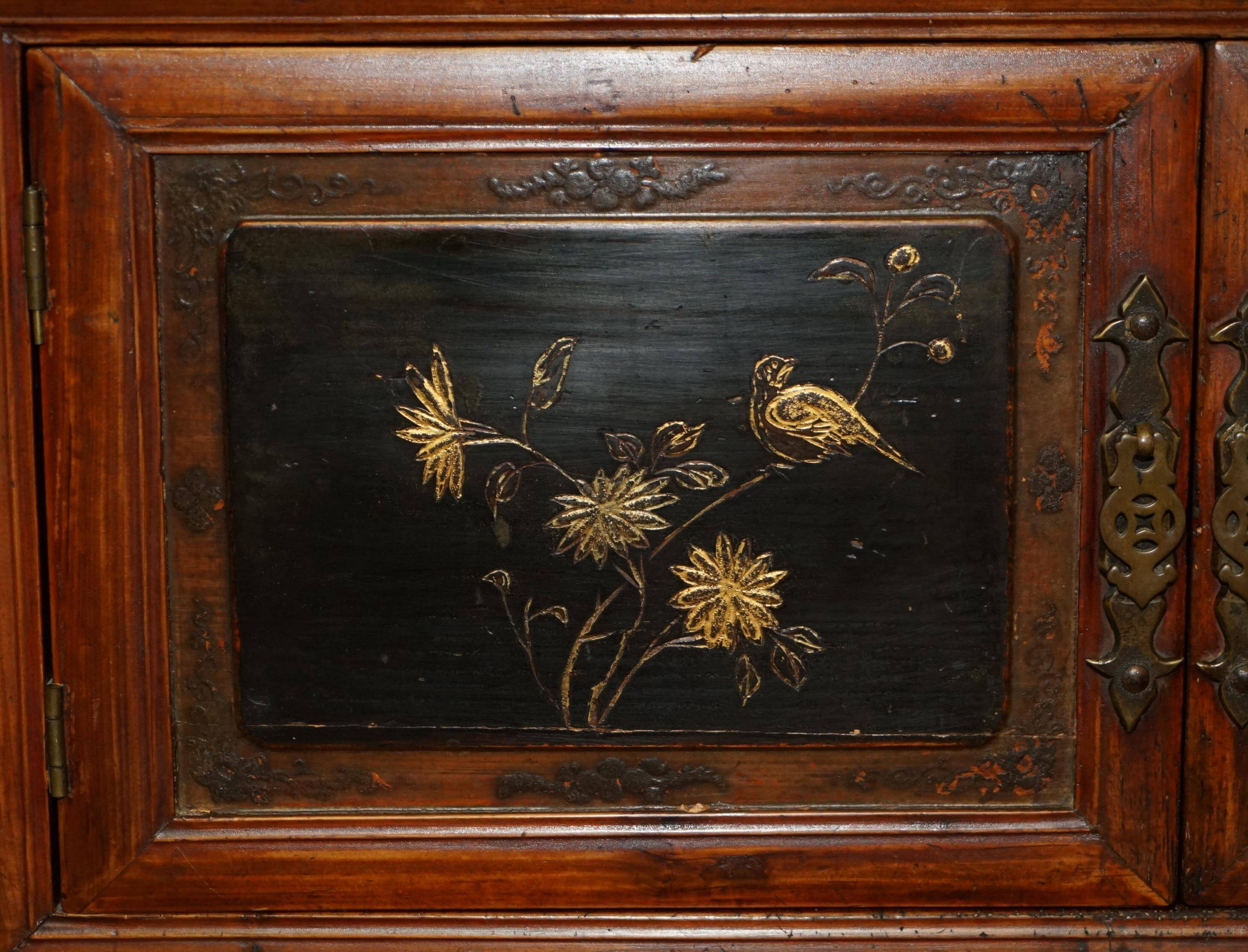 Antique Chinese armoire hand-carved around 1880 with country-style handles.