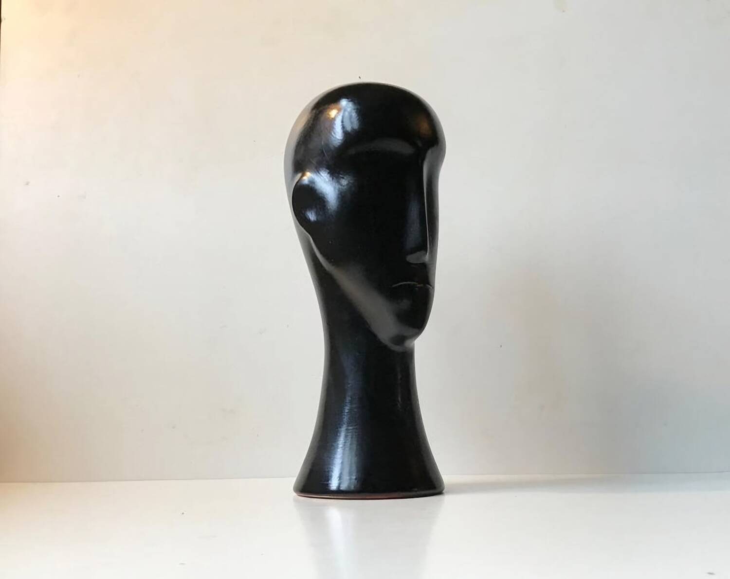 Modernist black ceramic sculpture – stylised head – 1960s