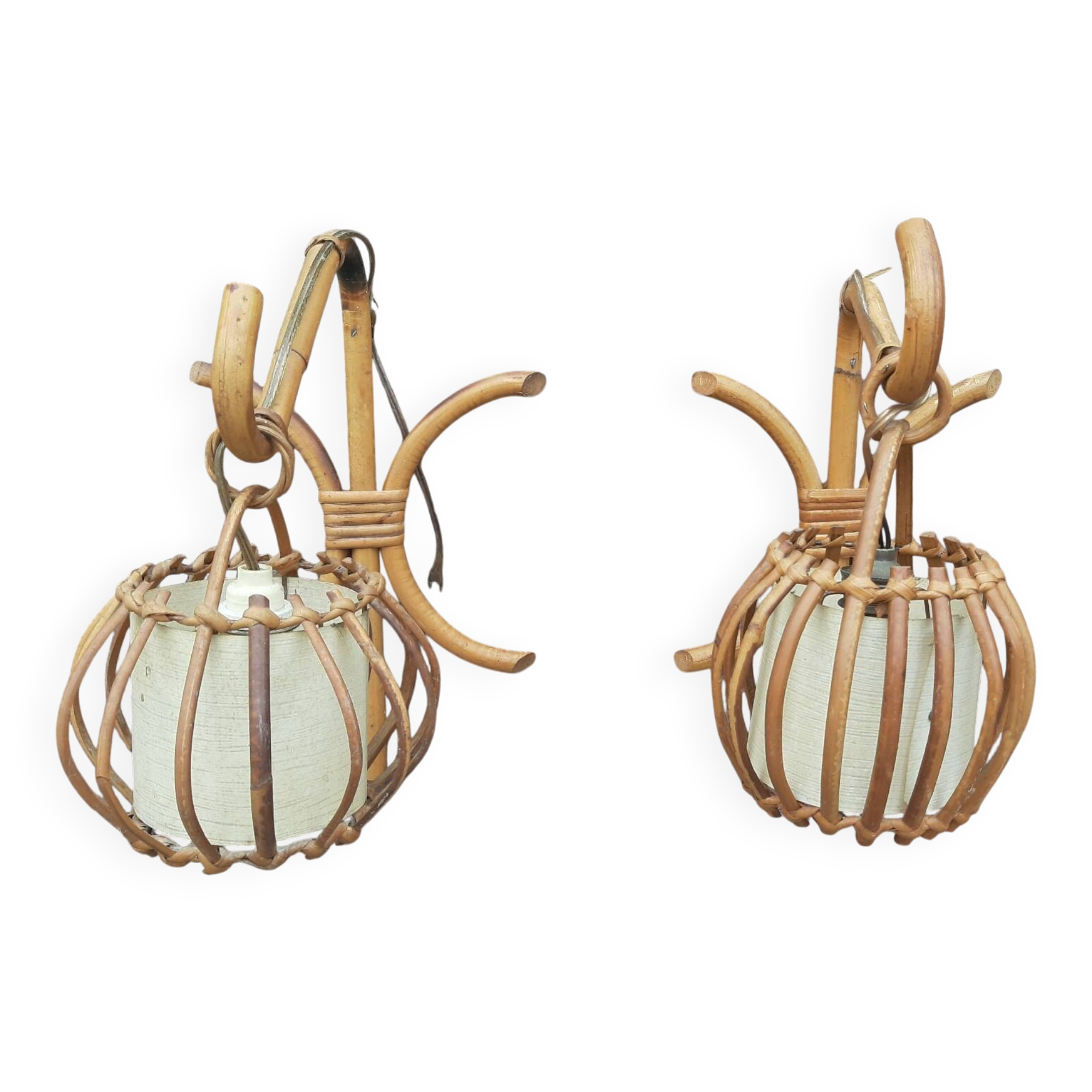 Pair of Louis Sognot rattan wall lights.