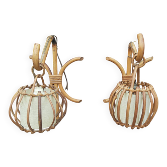 Pair of Louis Sognot rattan wall lights.