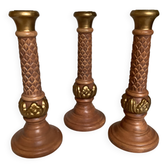 Trio of large brown and gold candlesticks