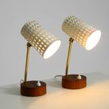 A pair of mid-century modern bedside lamps with perforated metal shades