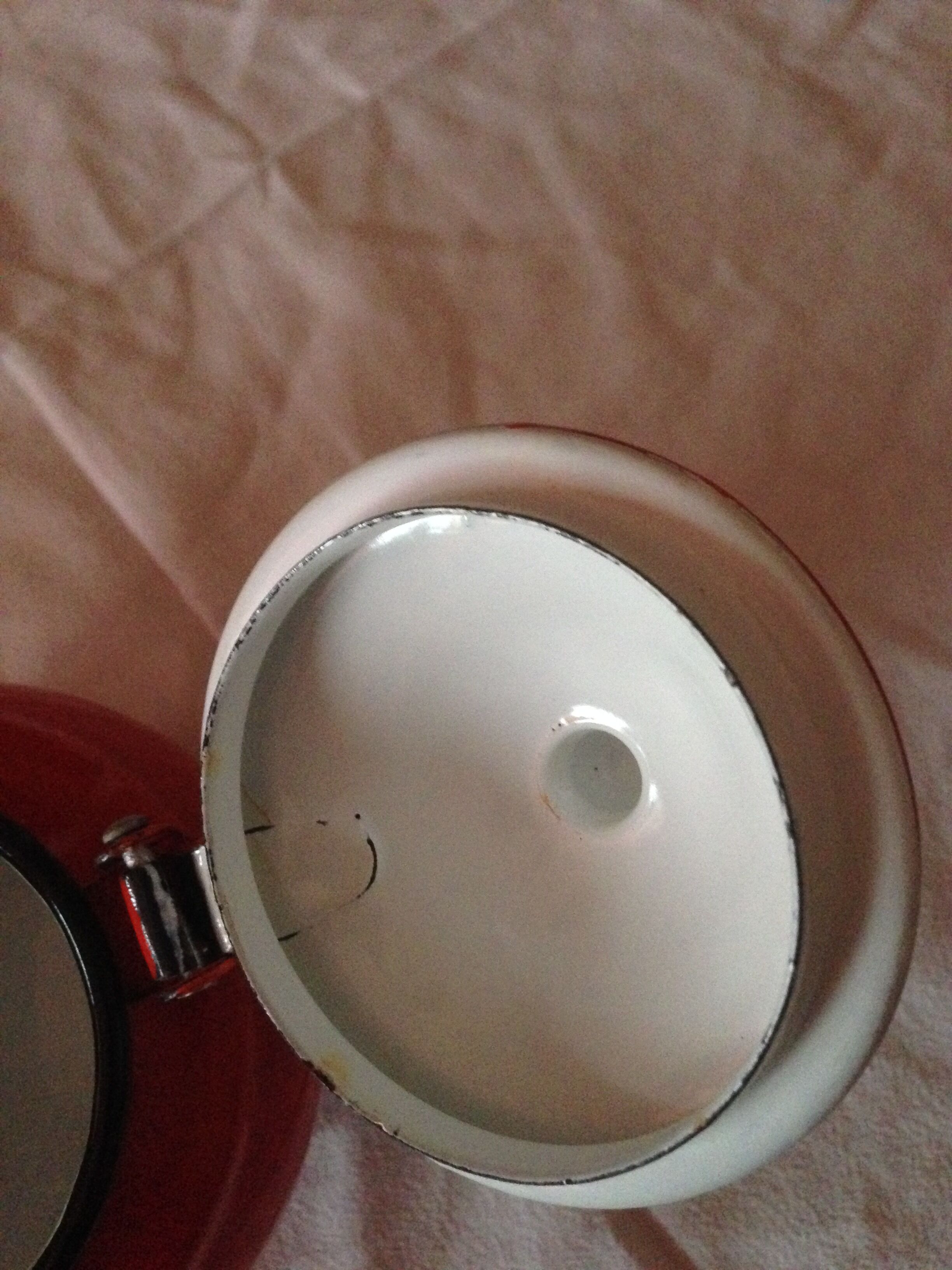 Small red metal teapot