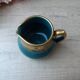 Old small Sadler cream pot in blue-green ceramic with a gold pattern, English milk jug.