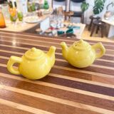 Salt and pepper shakers in the shape of a teapot.