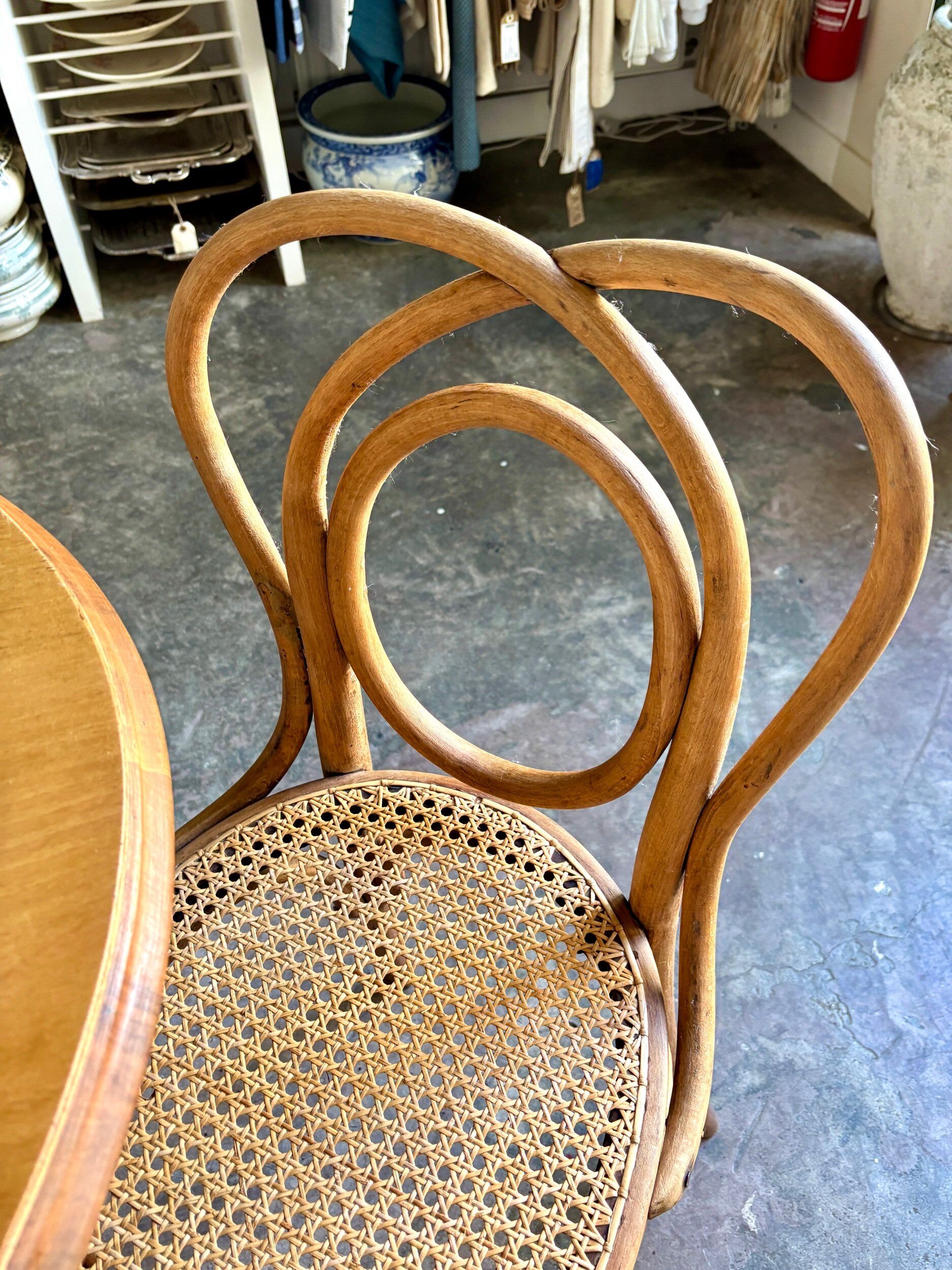 Thonet table no. 3 and 4 bent beech chairs with caning, circa 1890.