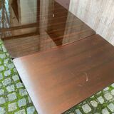 Scandinavian extendable dining table made of solid wood and rosewood effect.