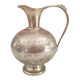 Chiseled brass pitcher decorated foliage