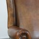 Sheepskin wing chair + XXL patinated footrest