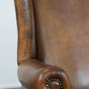 Sheepskin wing chair + XXL patinated footrest