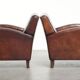 Dark cognac-coloured set of 2 sheepskin armchairs with a sleek design