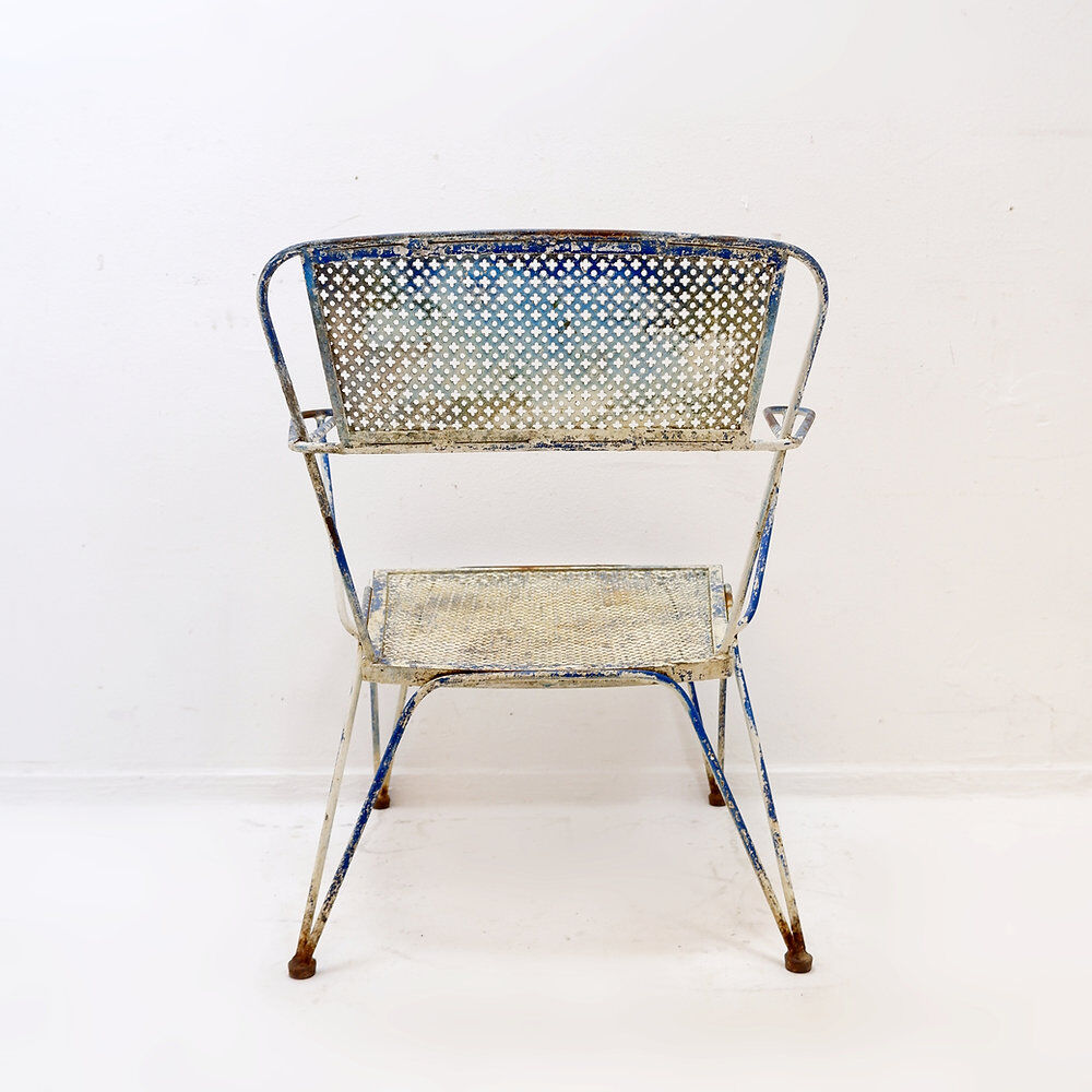 Vintage perforated metal armchair from the 1950s.
