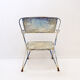 Vintage perforated metal armchair from the 1950s.