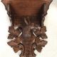 Pair of carved wooden wall consoles decorated with a deer's head