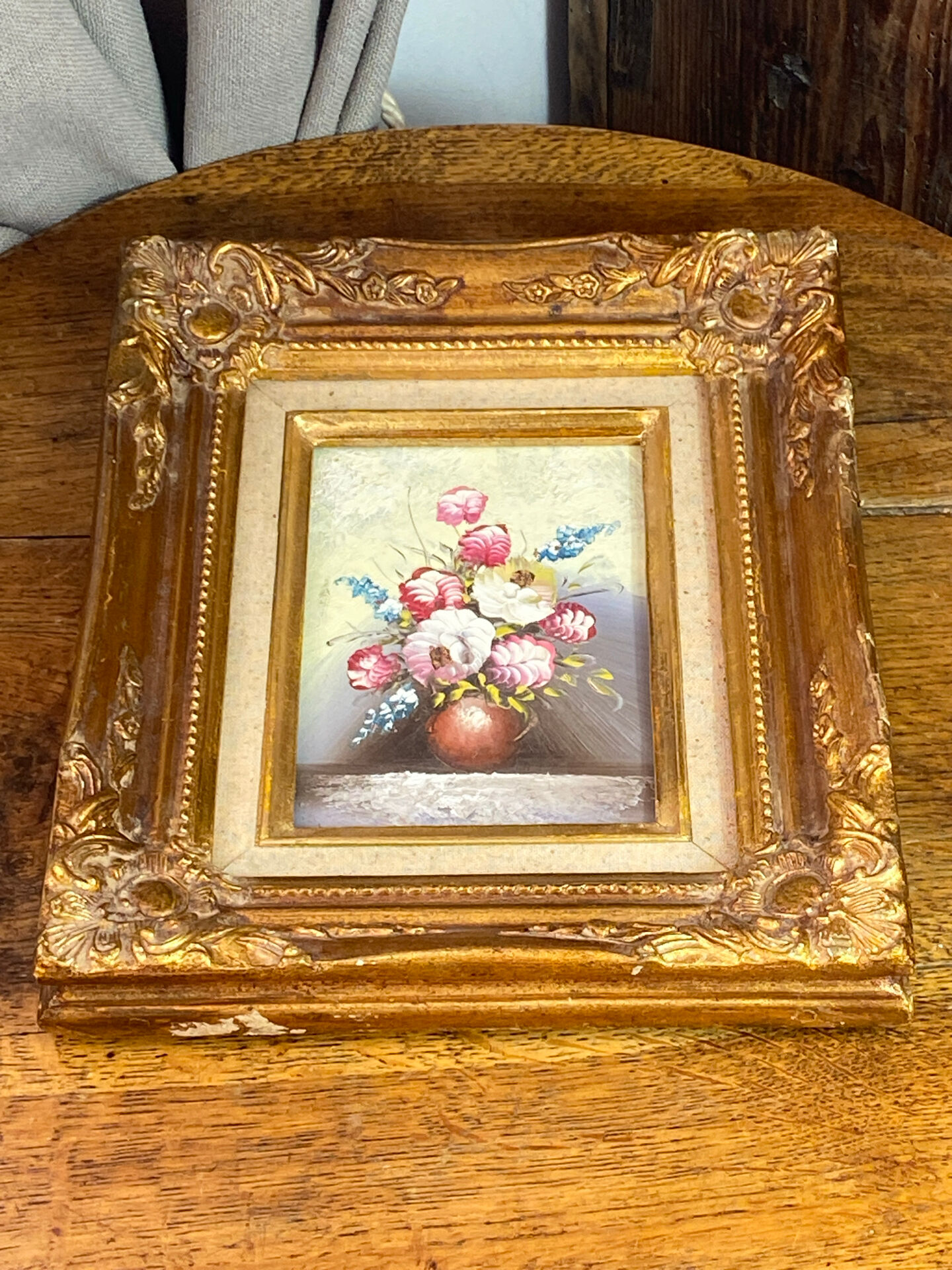 Still life, painting on hardboard, wooden and stucco frame.