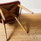 Chaise en skai rouge, pieds compas, années 60
