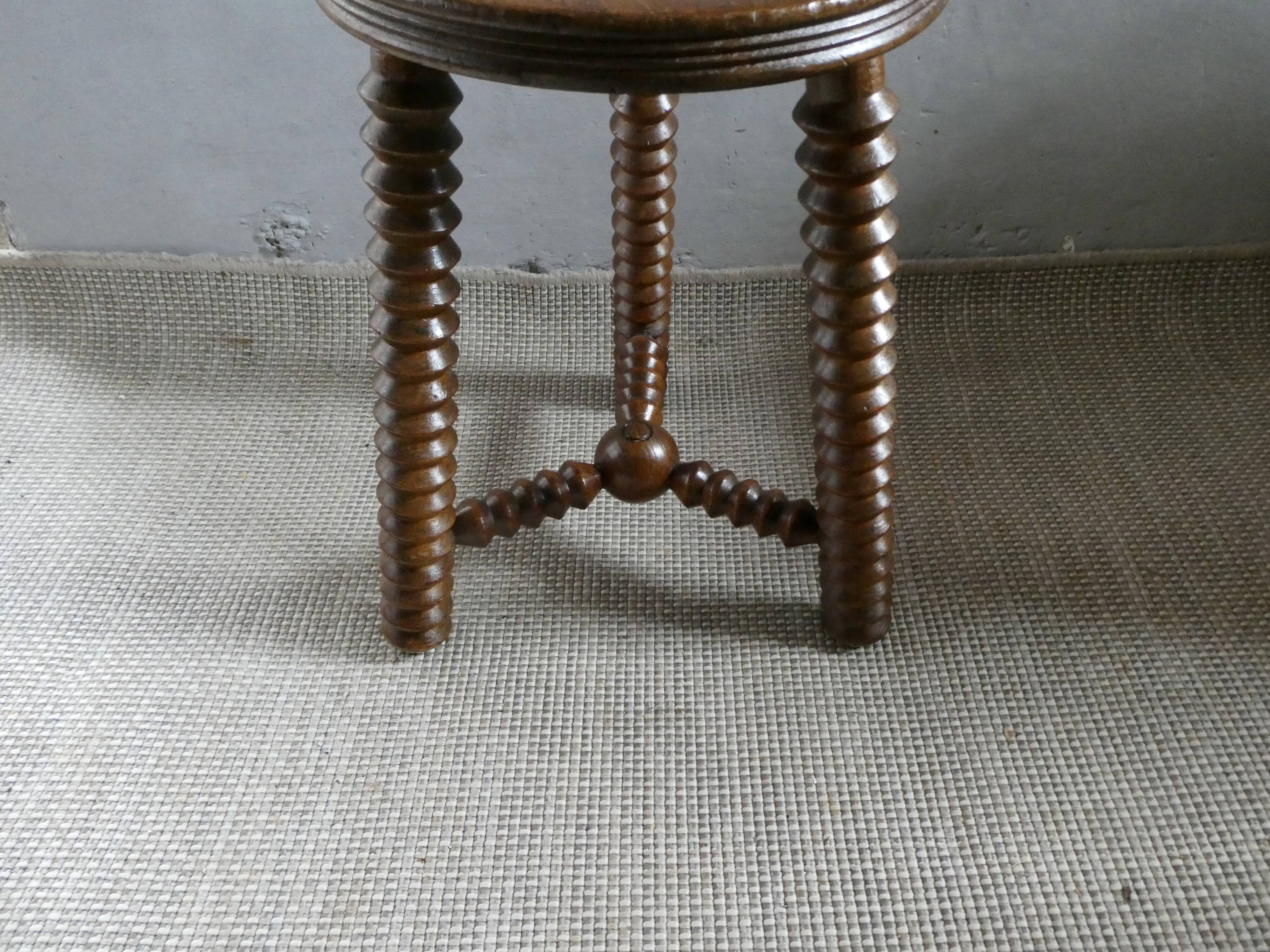 Tripod stool, with carved legs, around 1940