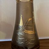 Vintage smoked glass carafe with gold from the 50s/60s, featuring a marine and water skiing design.