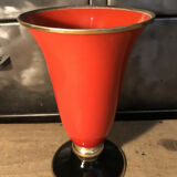Cut vase on foot in red and black metal