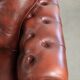 Vintage set of 2 cowhide leather Chesterfield armchairs in a brown colour