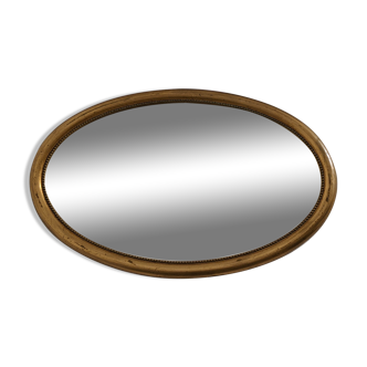 Miroir ovale en bois et stuc doré XIXème 80x52cm