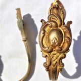 Old curtain kiss in gilded bronze
