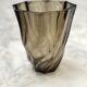 Small translucent dark brown twisted glass vase
