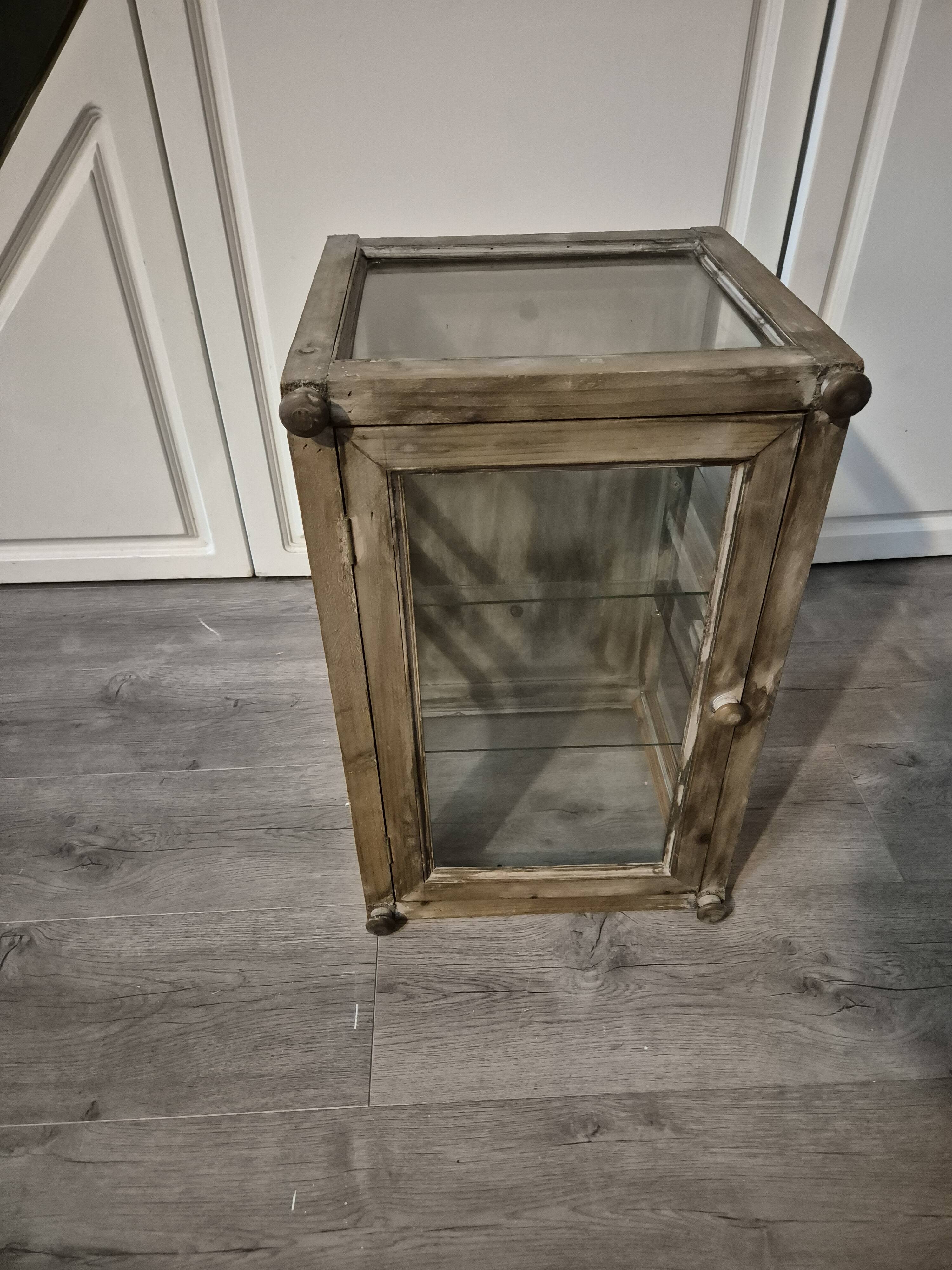 Brown weathered wooden display cabinet with 2 glass shelves.