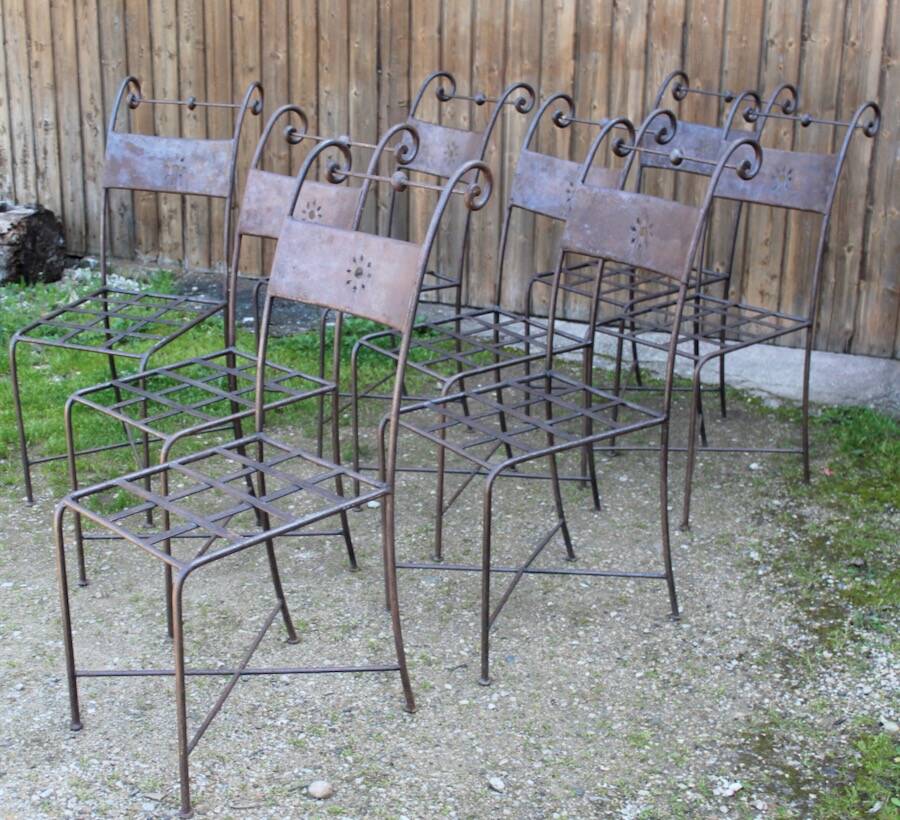 Series of 8 wrought iron garden chairs