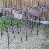 Series of 8 wrought iron garden chairs