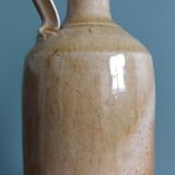 Bottle with handle, pitcher, in stoneware, signed