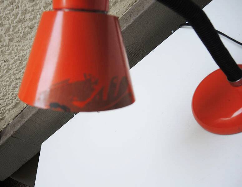 Old orange enameled sheet metal lamp