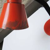 Old orange enameled sheet metal lamp
